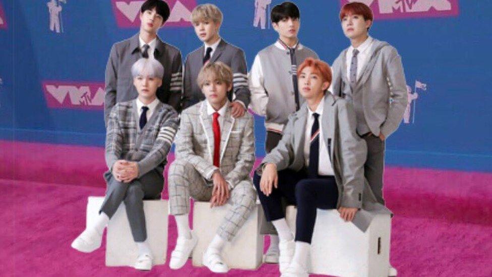 BTS photoshopped onto the pink carpet