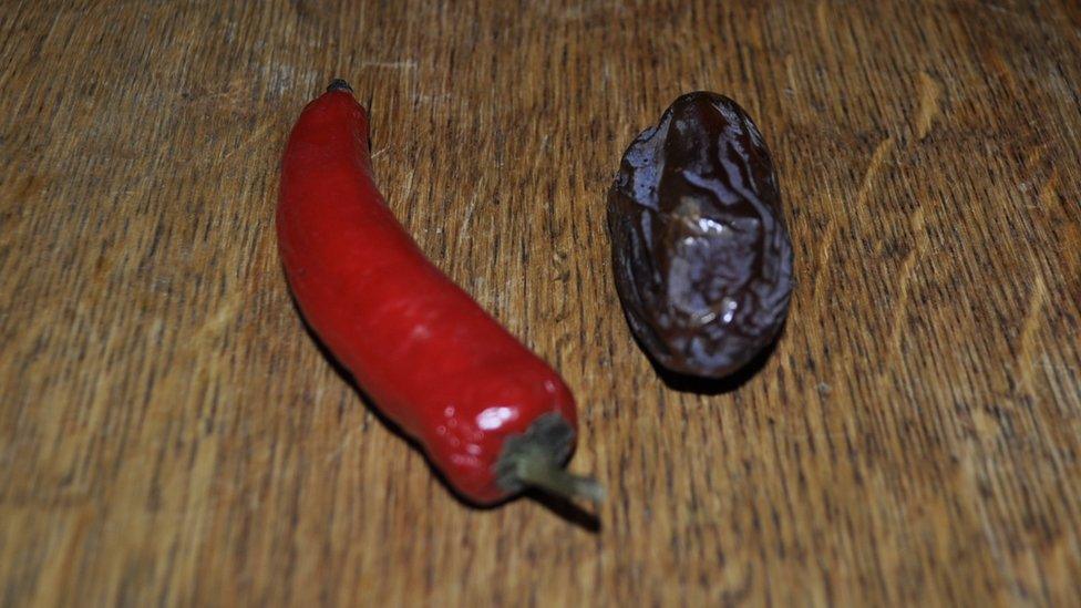 A pepper and a date together