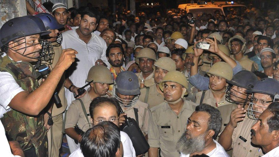 Angry mob at Nagfani police station after an objectionable WhatsApp message sparked communal tension on July 5, 2015 in Moradabad, India. Tension had prevailed in the district after an 'objectionable' message against a community was allegedly circulated on a social networking app