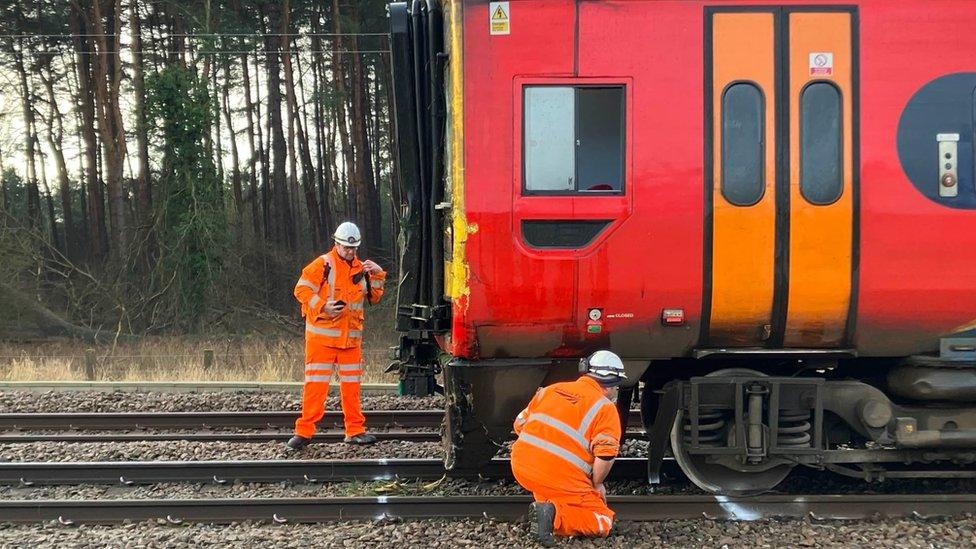 Engineers beside train that derailed