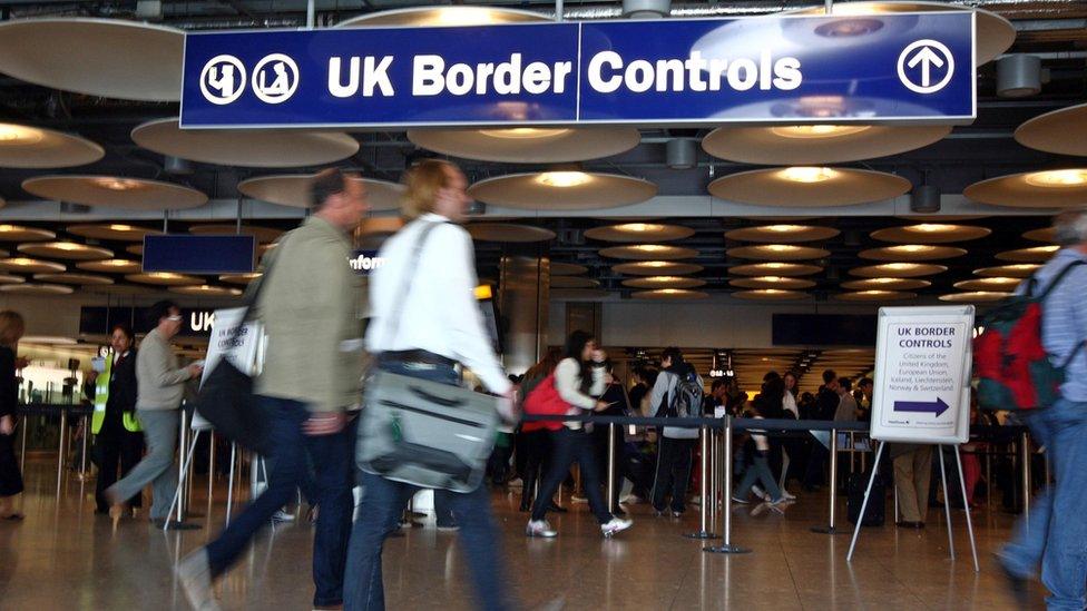 Airport passengers queuing