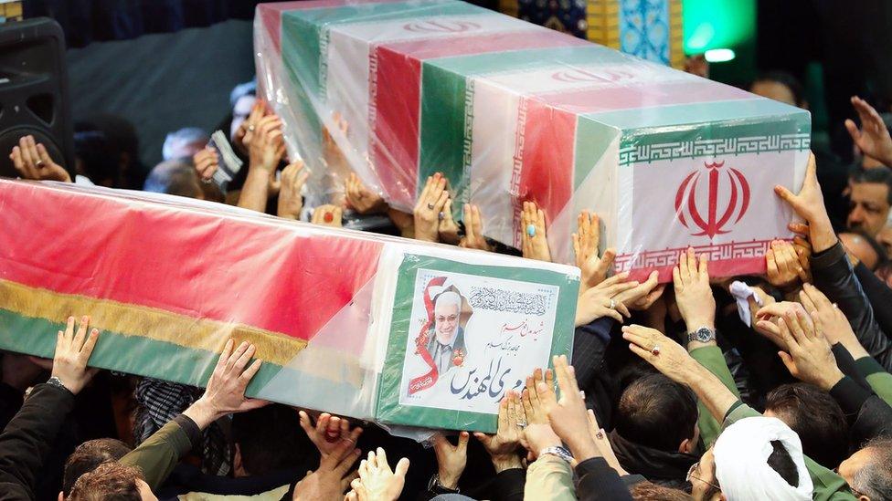 Mourners carry the caskets of Iranian military commander Qasem Soleimani (right) and Iraqi paramilitary chief Abu Mahdi al-Muhandis (left) in Tehran, 6 January 2020