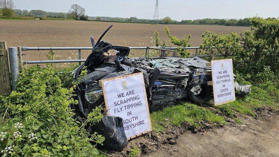 Crushed car in layby