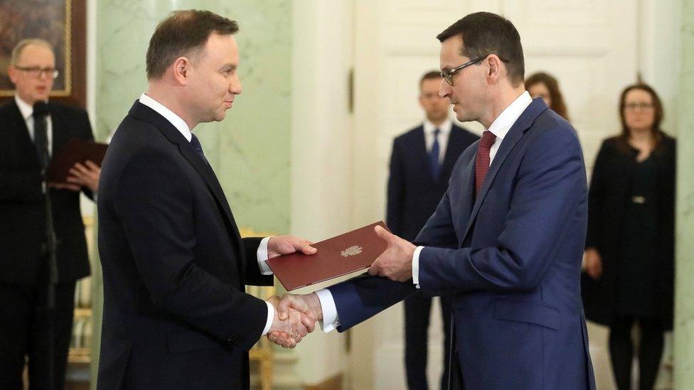 Polish President Andrzej Duda (L) confirms Mateusz Morawiecki as new prime minister in the Presidential Palace in Warsaw, 8 December 2017