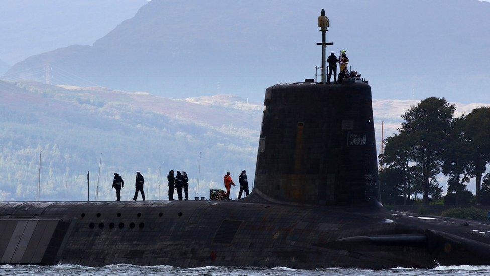 A Trident submarine makes its way out from Faslane naval base in Scotland