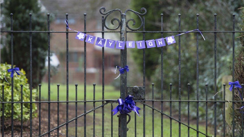 Purple ribbons on the gates of St Laurence Church