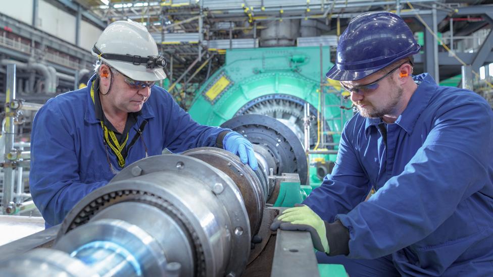 People working in a power plant