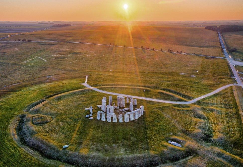 An aerial view of Stonehenge without any cars or people nearby