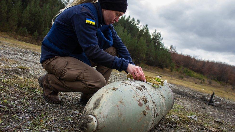 Woman undertaking bomb disposal training