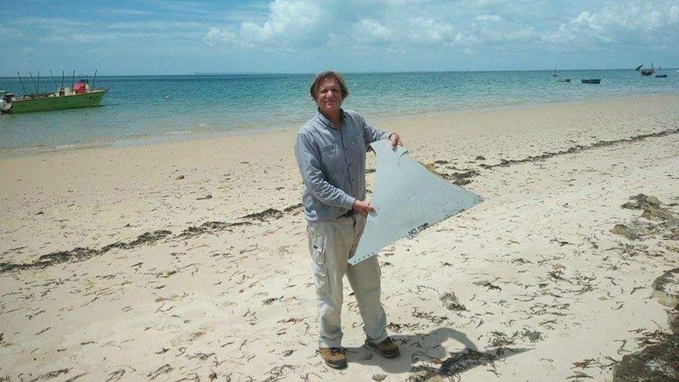 Blaine Gibson with piece of debris found in Mozambique