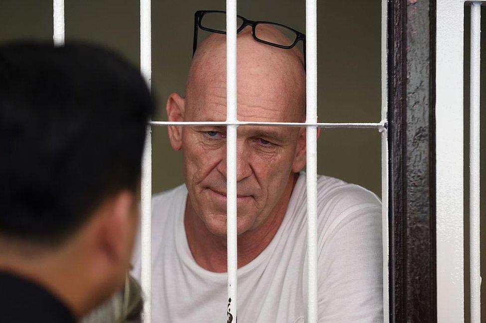 Former British war correspondent David Fox inside a holding cell