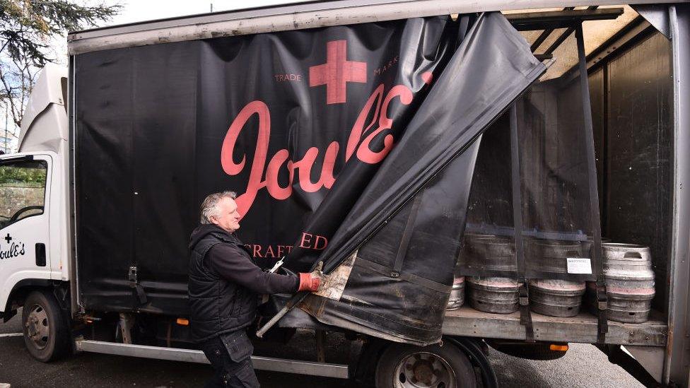 James Ellis employee of Joules Brewery, delivers beer at the White Horse Pub on April 06, 2021 in Shrewsbury