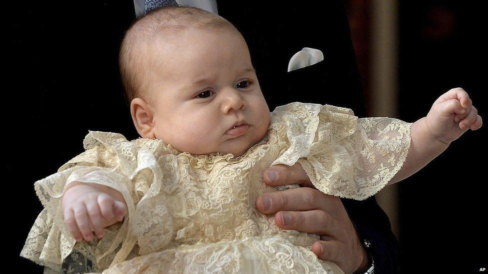 Prince George at his christening wearing a traditional Victorian outfit.