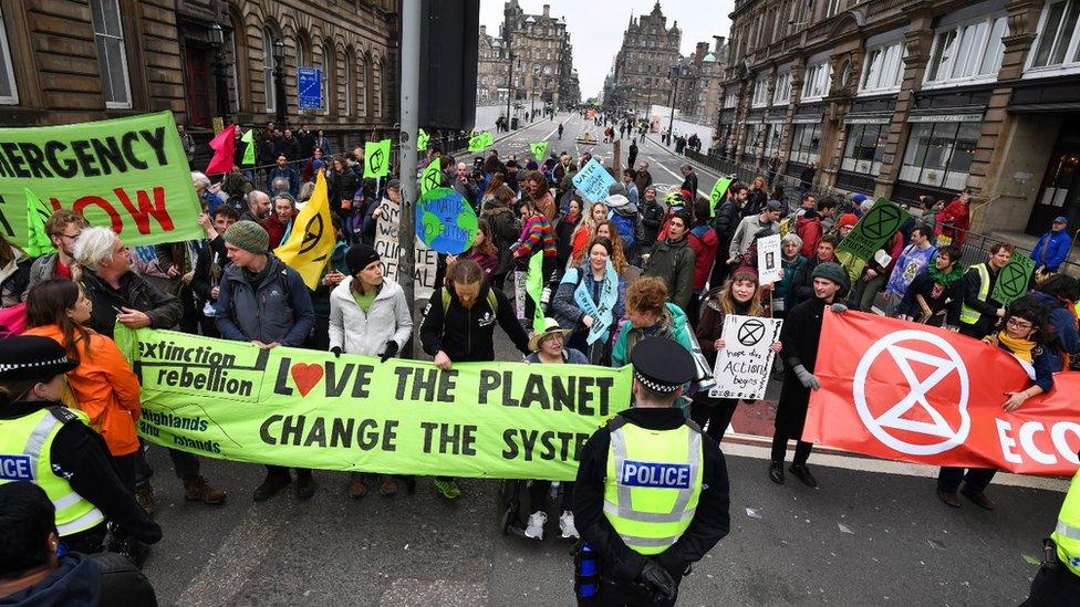 Climate change protesters block one of the main roads into Edinburgh's city centre on April 16, 2019 in Edinburgh, Scotland. Supporters of Extinction Rebellion Scotland targeted North Bridge as part of the Extinction Rebellion protests, which has taken place in a number of cities across the UK.