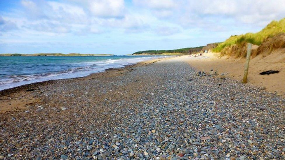 A dad and two children were rescued from Llanddwyn beach, Anglesey