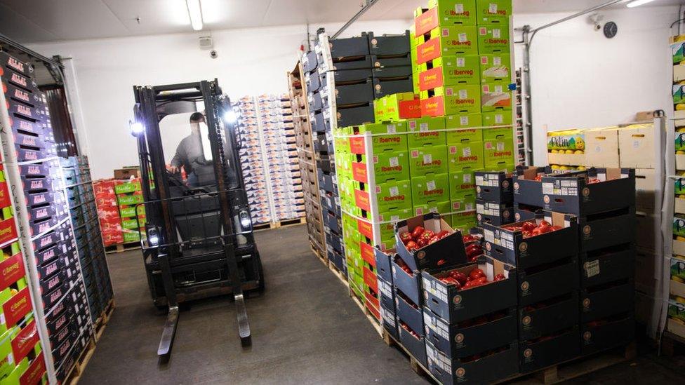 Boxes of fresh produce in a market