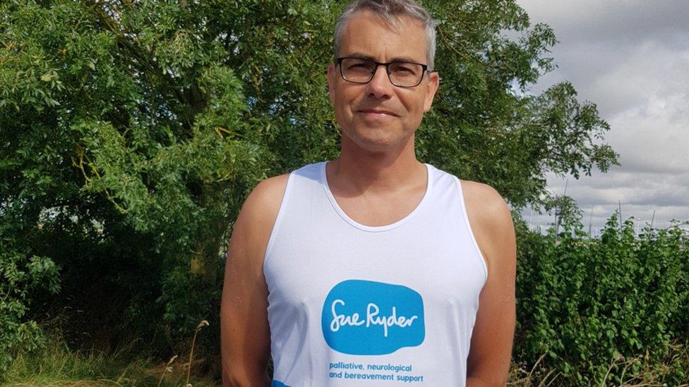 Richard Ostler wearing a running shirt with Sue Ryder written on it