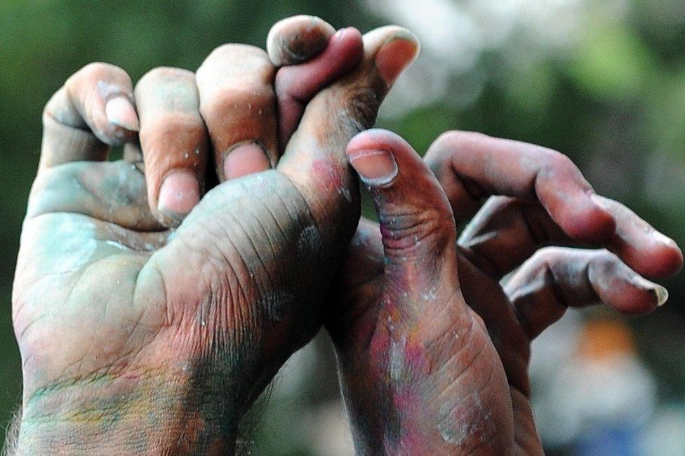 Members of the transgender, gay and lesbian communities hold hands during a rally to celebrate an Indian court's ruling to decriminalise gay sex between consenting adults