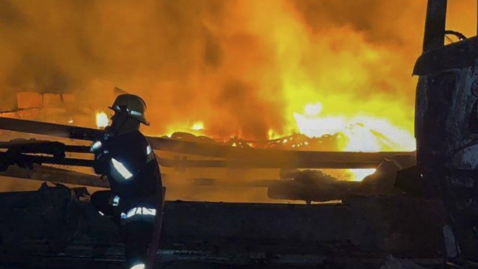 Emergency Service of Ukraine picture shows rescue workers after a drone hit the Danube River port infrastructure, Ukraine, 3 September 2023