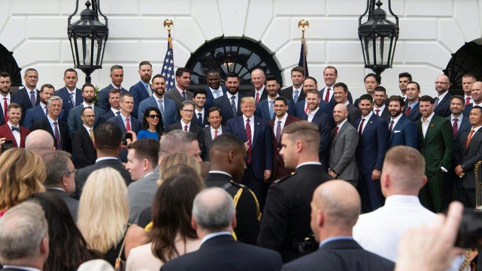 US President Donald Trump (C) poses with the 2018 World Series Champions Boston Red Sox at the White House in Washington, DC, on May 9, 2019