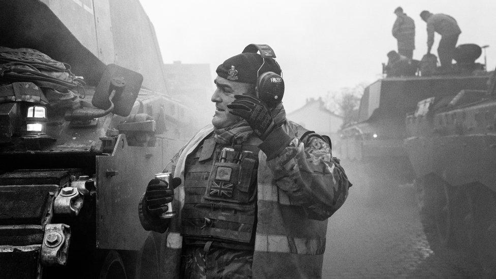 Tank Commander Corporal Matty Hall of D Squadron The Queen’s Royal Hussars lining up tanks at the rail head before loading on to flat wagons at Sennelager railway station, Germany, January 2019