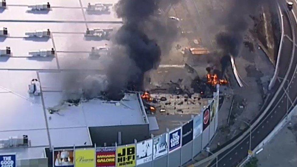 Television footage showed damage to a shopping centre