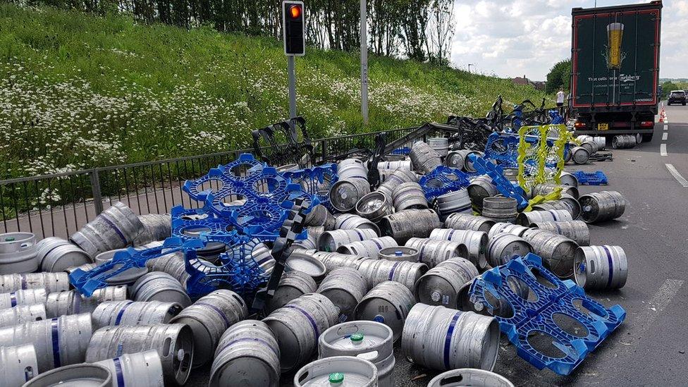 Beer kegs on the road, having falling from a lorry on the A43 near Towcester.