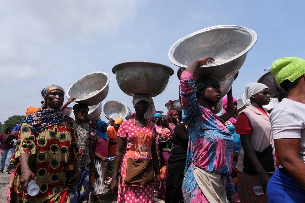 Head porters march in the streets on the second day of protests over recent economic hardships, in Accra, Ghana, June 29, 2022