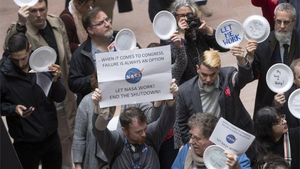 People participate in the "Occupy Hart" protest against the partial government shutdown