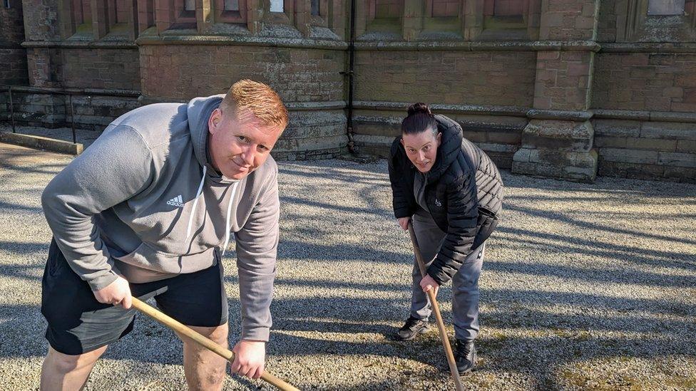 Neil Mclaughlin and Kelly Scott clearing the church grounds