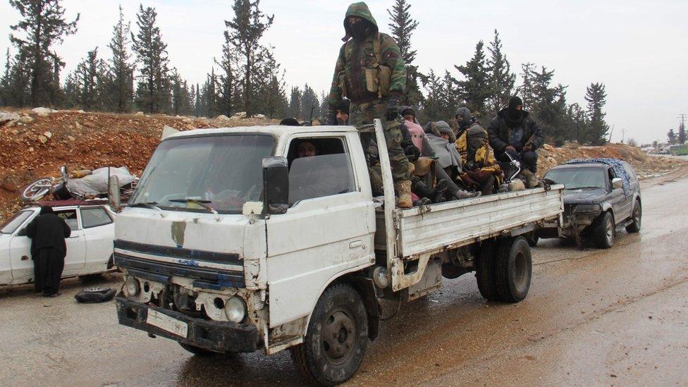 Syrians being evacuated from Aleppo drive through rebel-held territory near Rashidin (22 December 2016)