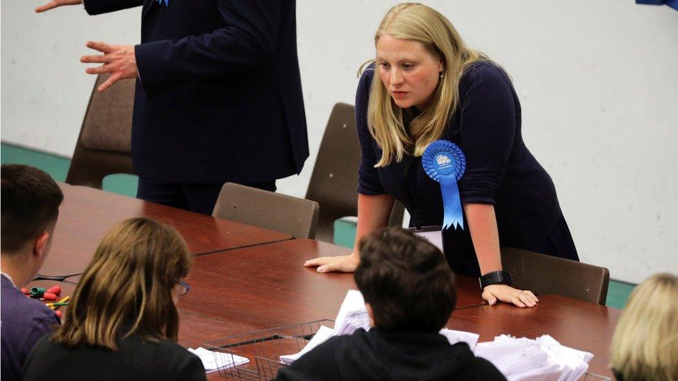 A Conservative party worker keeps a close eye on the recount of votes in Hastings