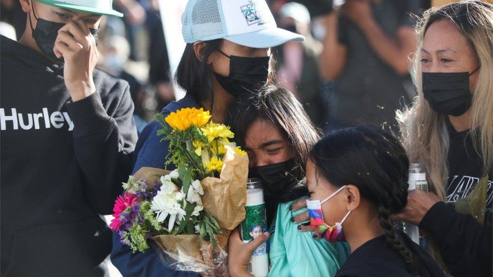 Mourners weep at a vigil for victims of the rail yard shooting in San Jose, May 2021