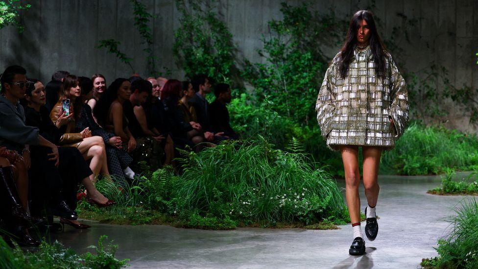 A model presents creations by Gucci at a fashion show in Tate Modern