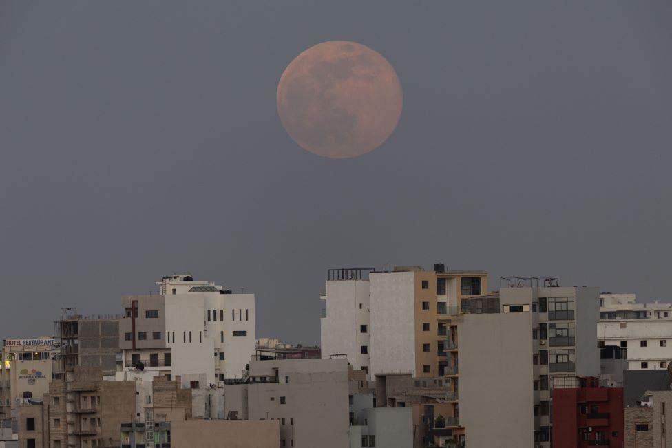 The supermoon rises over apartment blocks in Dakar, Senegal - Wednesday 5 November 2025.