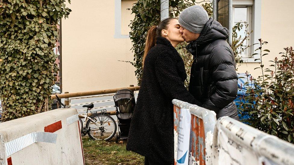 Couple kiss over barrier in Basel