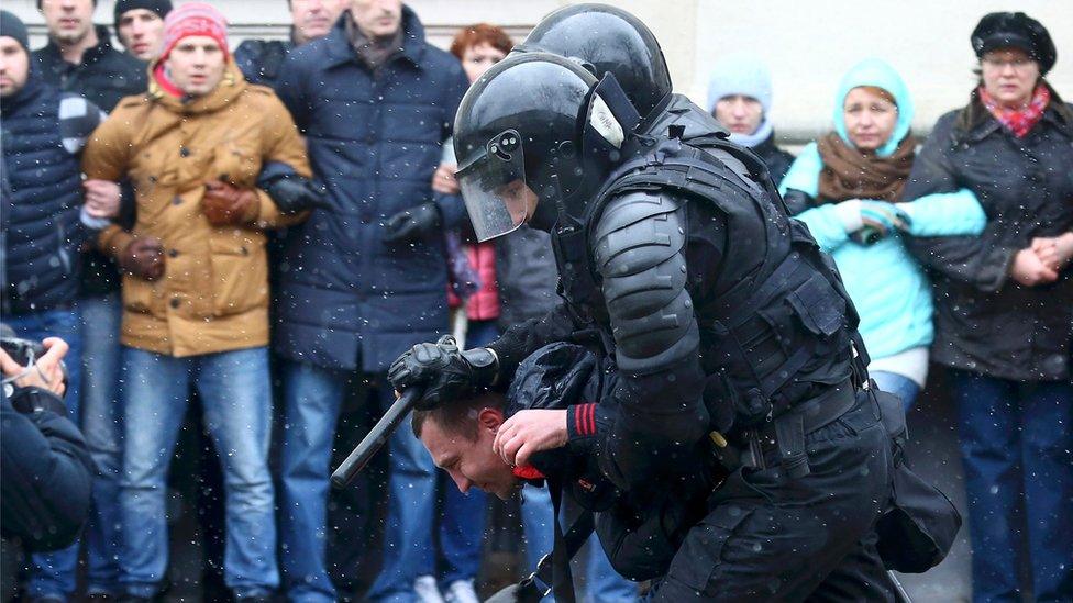 police detain protester