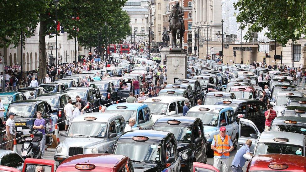 Taxis blockade Whitehall in protest at Uber in June 2014