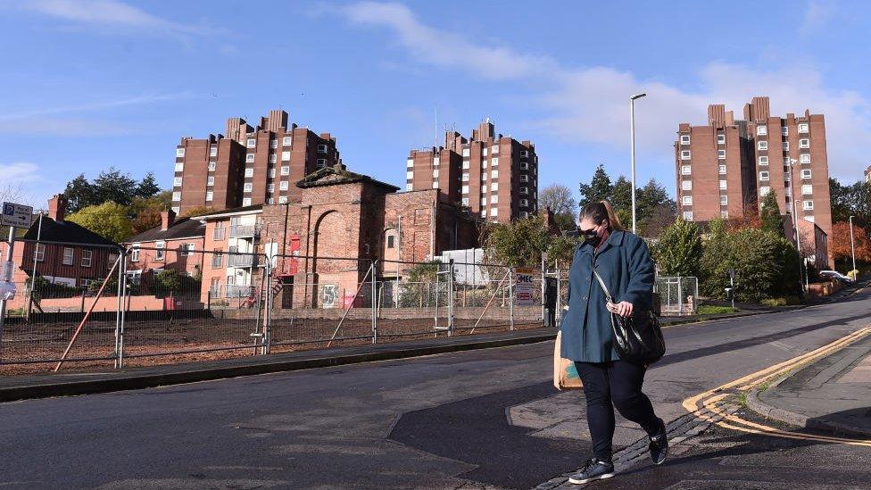 A woman walks in Stoke-on-Trent