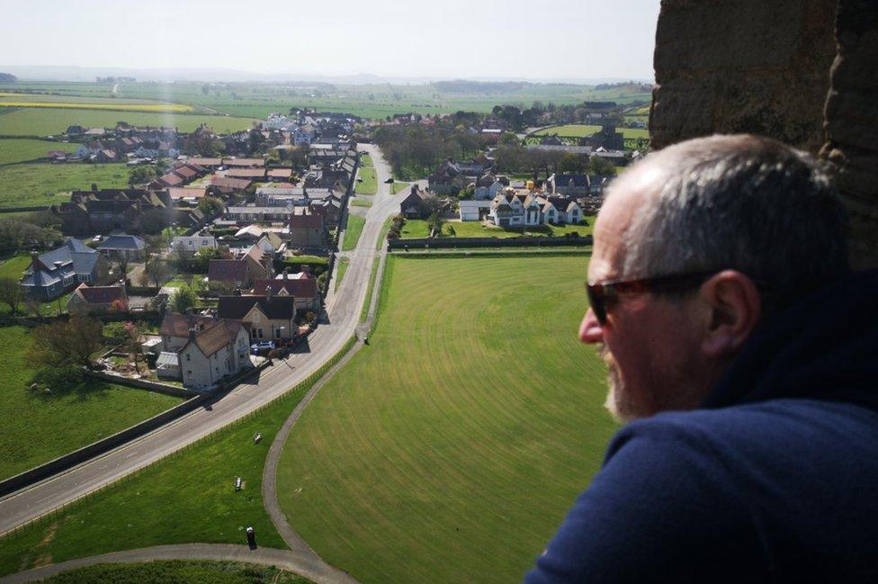 Andrew Heely looks over the village of Bamburgh