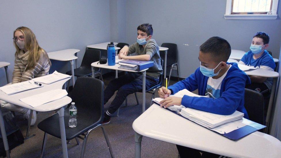 Children studying in a classroom.