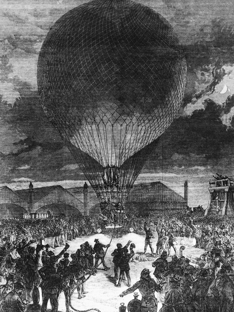 A balloon leaving Paris by night, carrying mail out of the city during the siege by Prussian forces, December 1870.