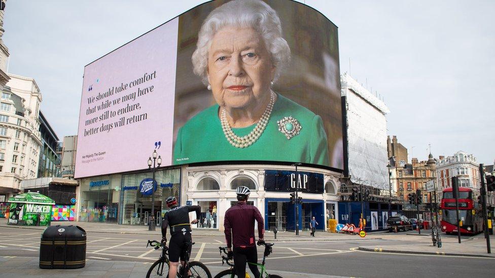 An image of Queen Elizabeth II and quotes from her broadcast on Sunday to the UK and the Commonwealth in relation to the coronavirus epidemic are displayed on lights in London"s Piccadilly Circus.