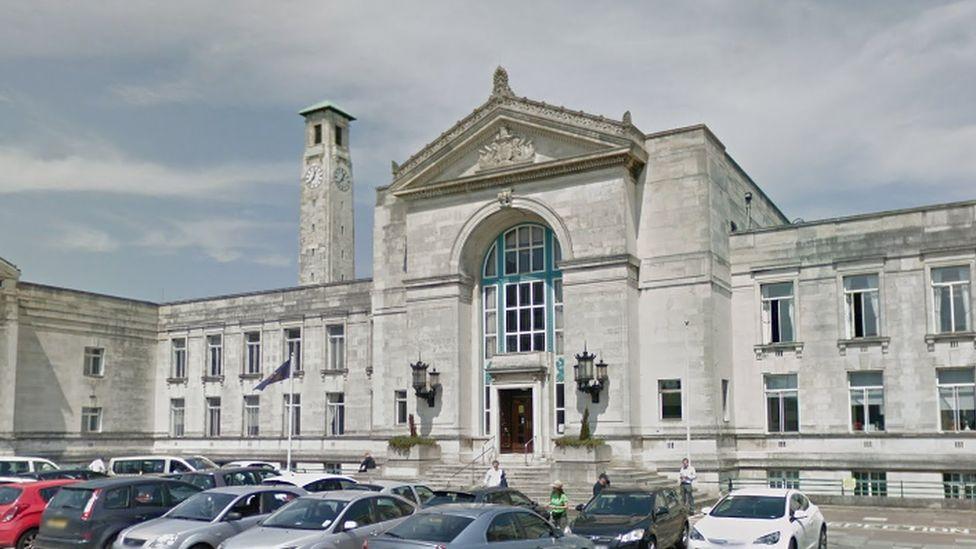 Southampton City Council building with car park outside.