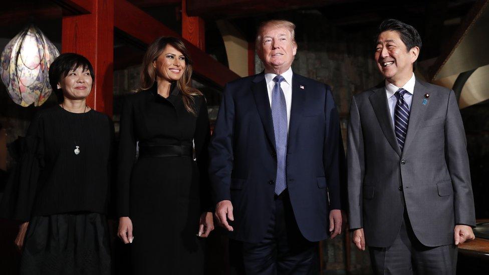 Mr Trump and Abe with their wives