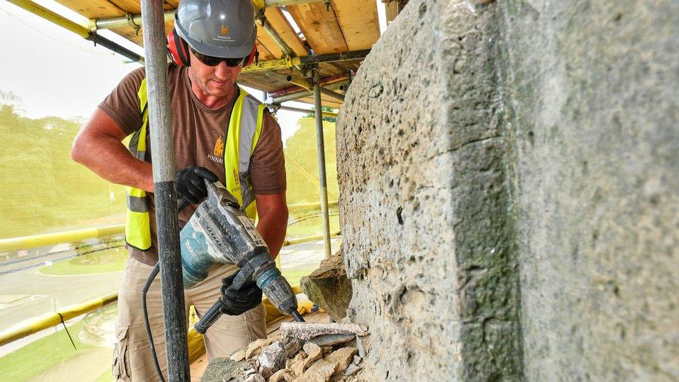 Stonemason Jon Cocker carrying out work on the museum rotunda