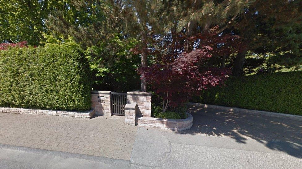 Google Streetview image of the gate leading to the property, from the road outside