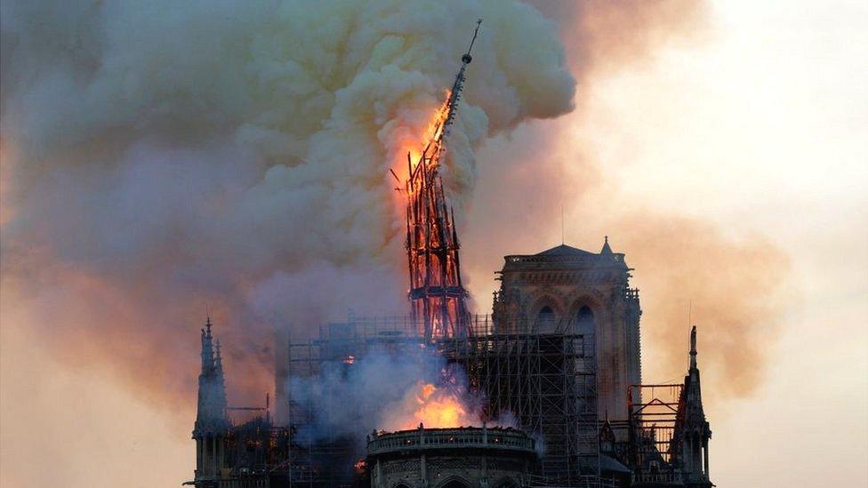 Notre Dame's spire collapses in a fire on 15 April 2019