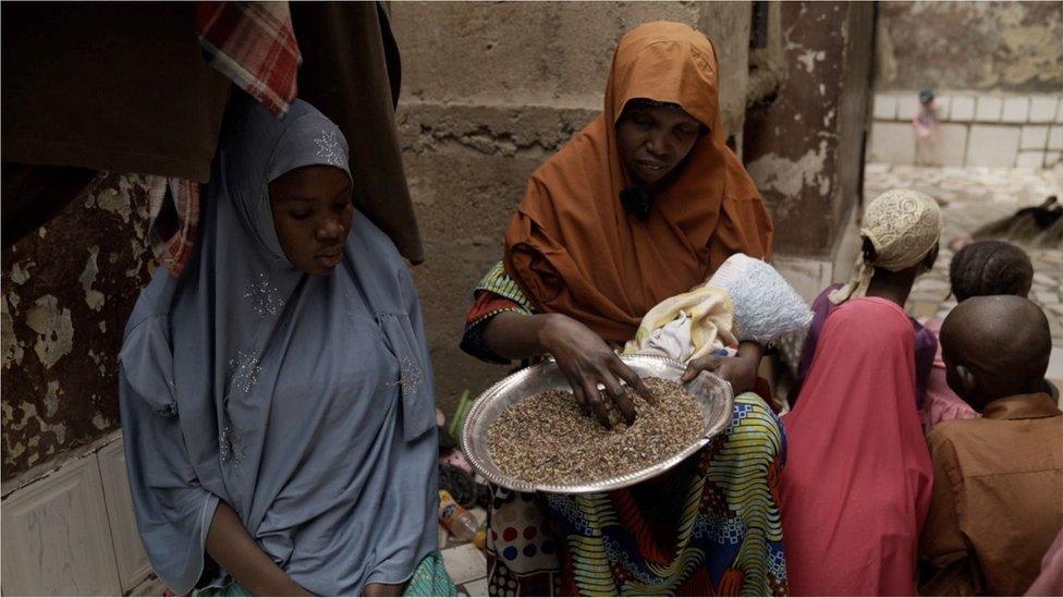 Ms Abubakar with a dish of broken, tough rice grains