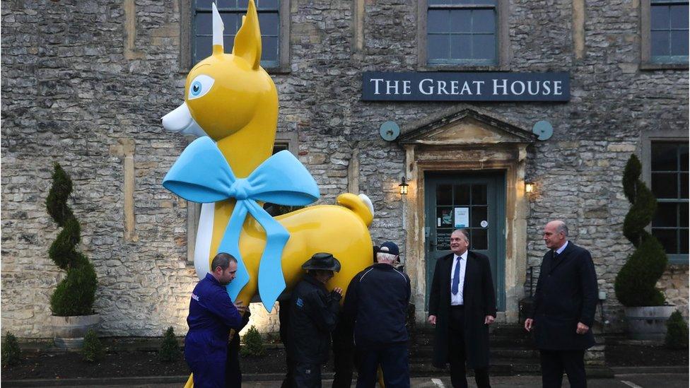 The deer being moved into place